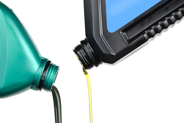 Different Oil Bottles Pouring