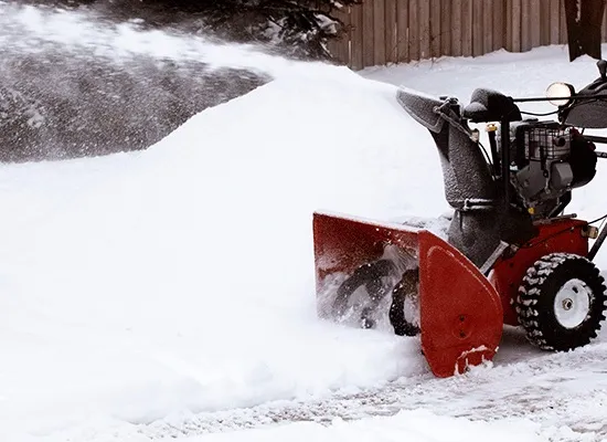 snowblower clearing driveway
